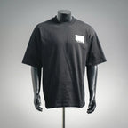 Black short-sleeve T-shirt with white chest Dior logo patch on a mannequin
