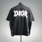 Black short-sleeve T-shirt with large white Dior logo graphic on the back