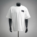 White Dior T-shirt on a mannequin, short sleeves, black chest logo patch