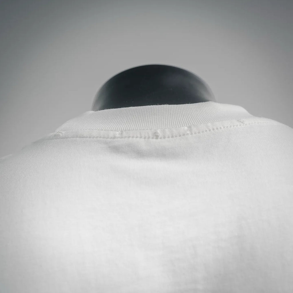 White Dior T-shirt collar close-up with ribbed neckline and top seam