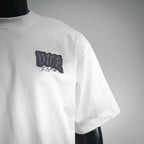White Dior T-shirt side view with black chest logo patch and short sleeve