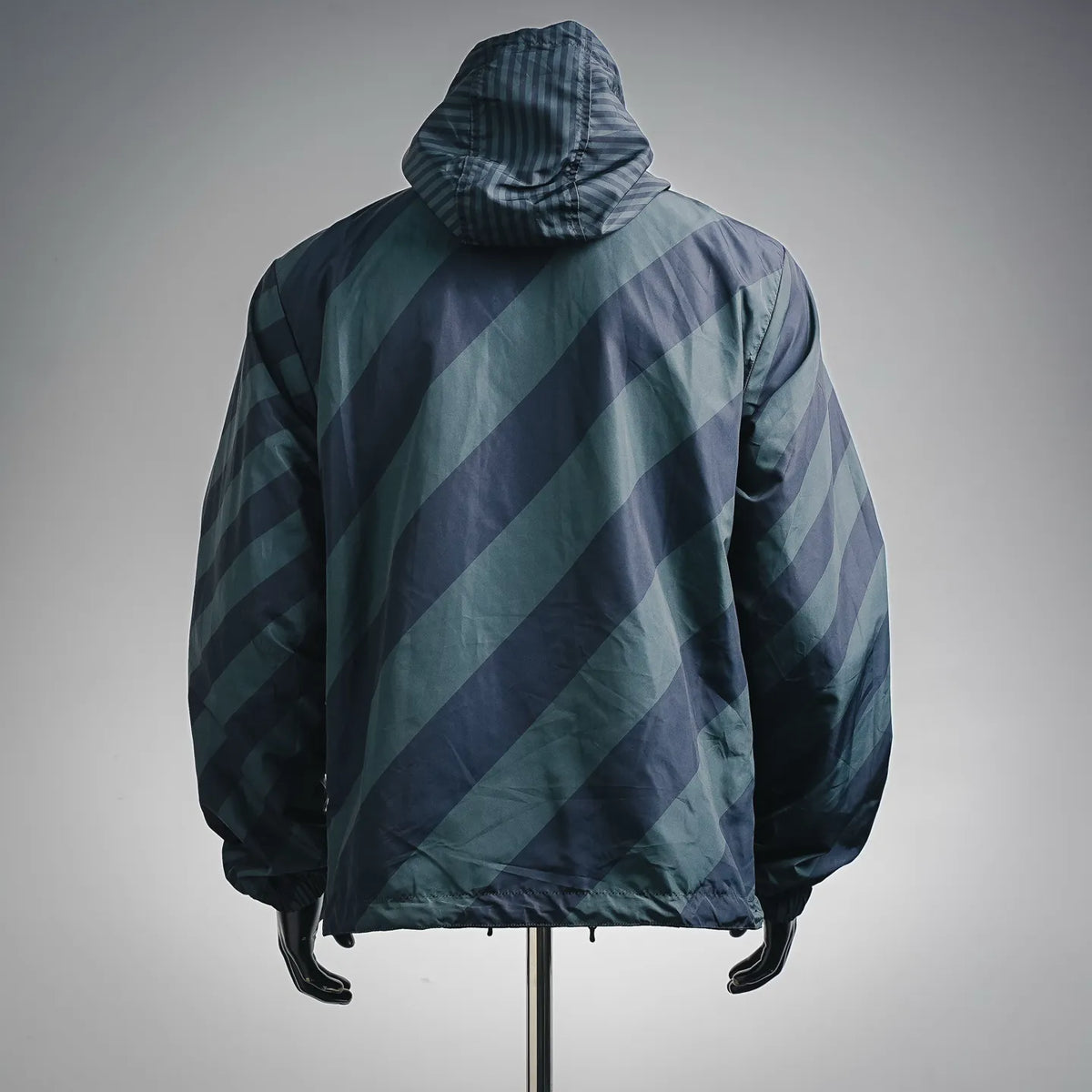 Fendi hooded coat with diagonal patterned panels, back view with elastic hem