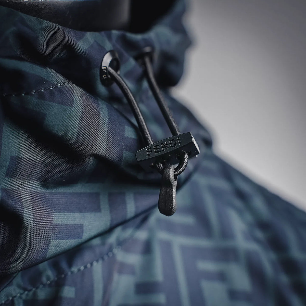 Fendi logo drawstring pull on hooded coat, close-up of black cord