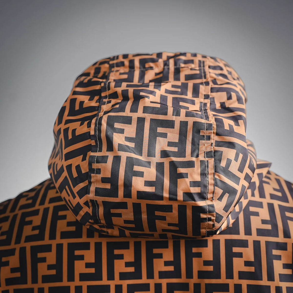FF monogram hooded coat close-up, patterned hood with gathered drawstring
