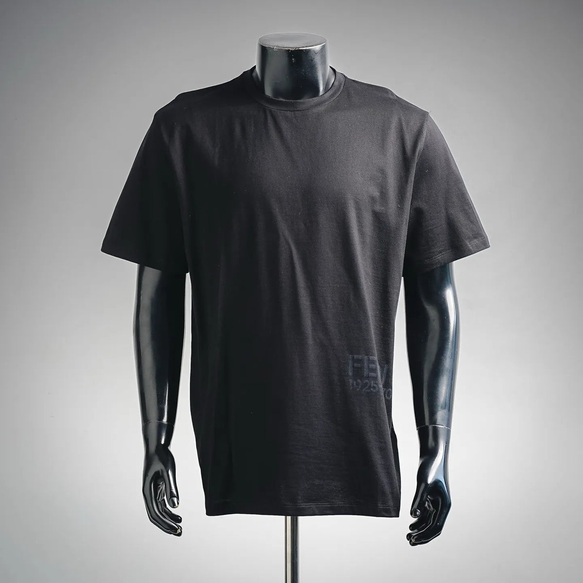Dark crewneck T-shirt with short sleeves, front view on a mannequin.