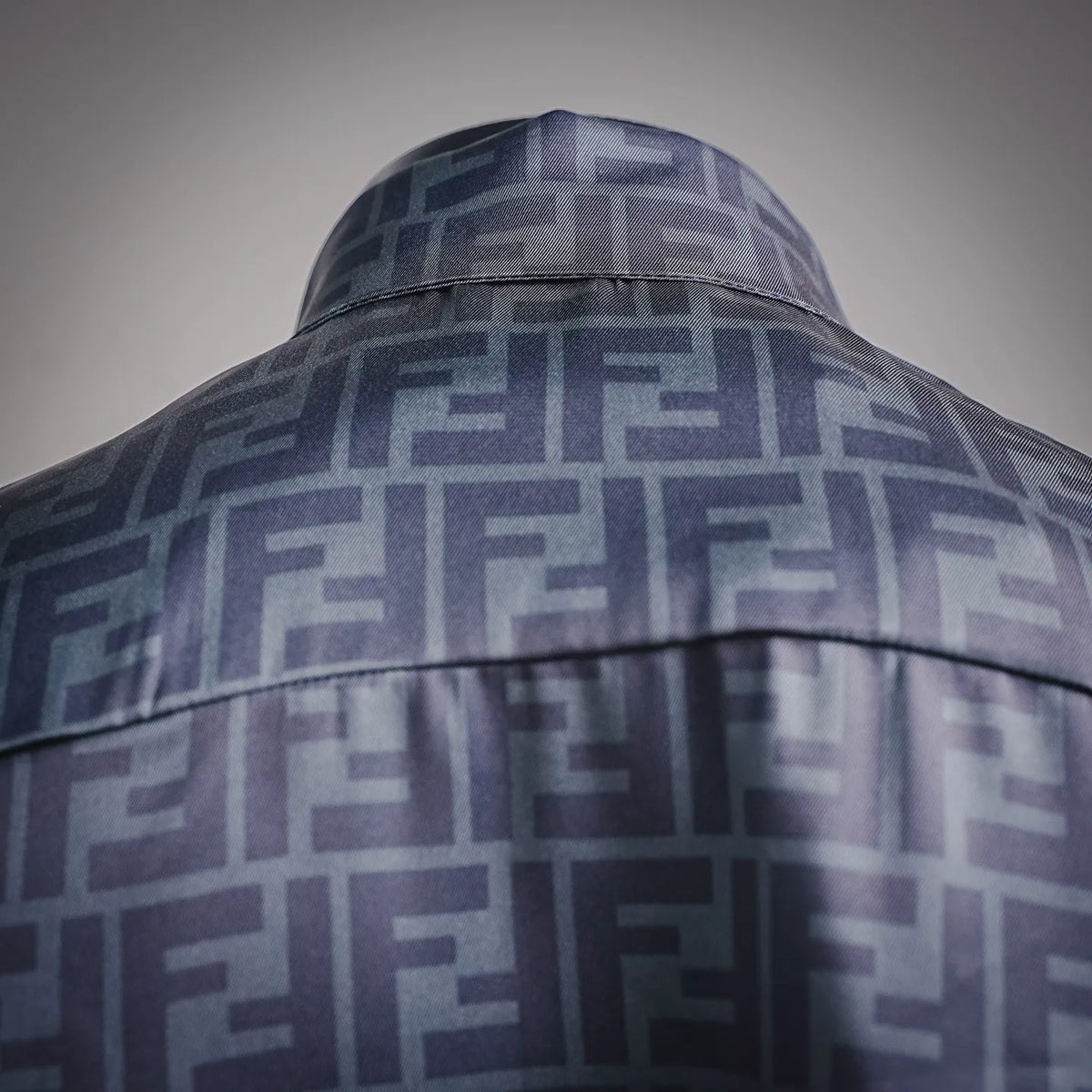Back yoke detail of Fendi long-sleeve shirt with dark blue logo pattern