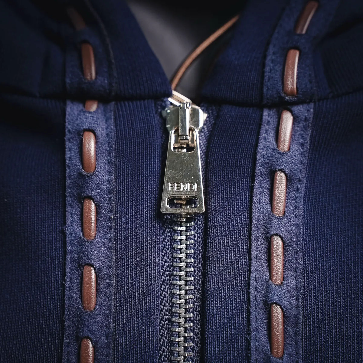 Fendi navy hoodie zipper with metal pull and FENDI leather logo tag