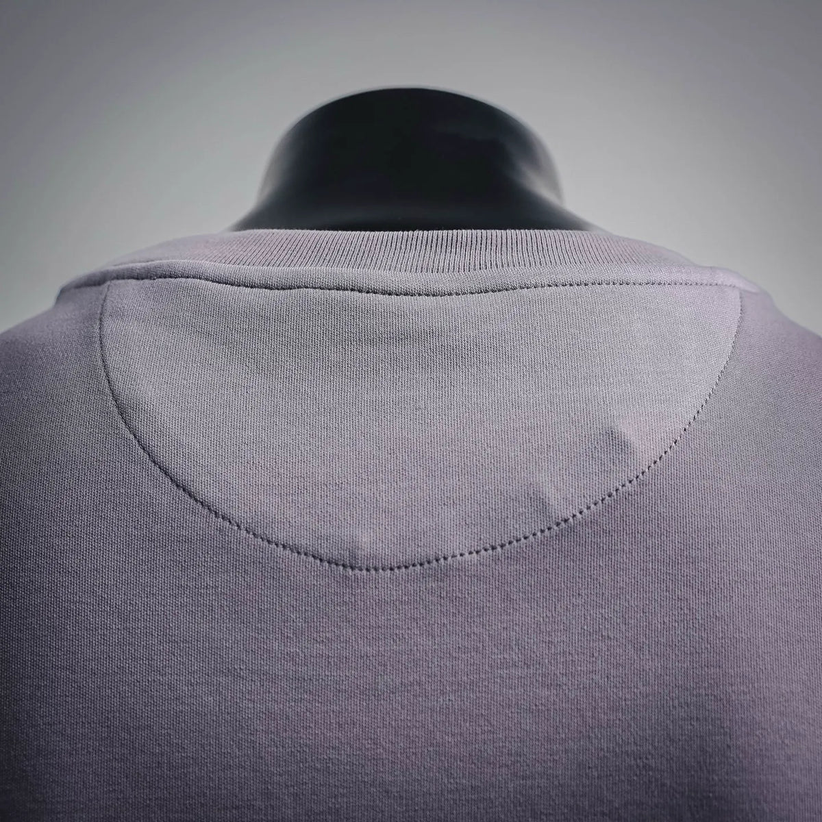 Lavender T-shirt back yoke with curved seam