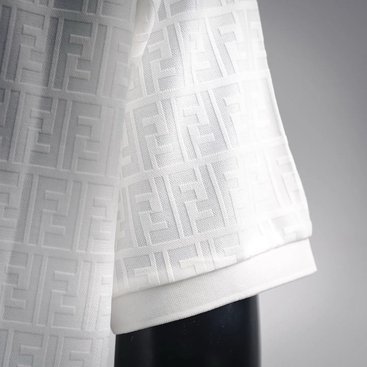 White polo shirt cuff and hem with FF jacquard knit texture