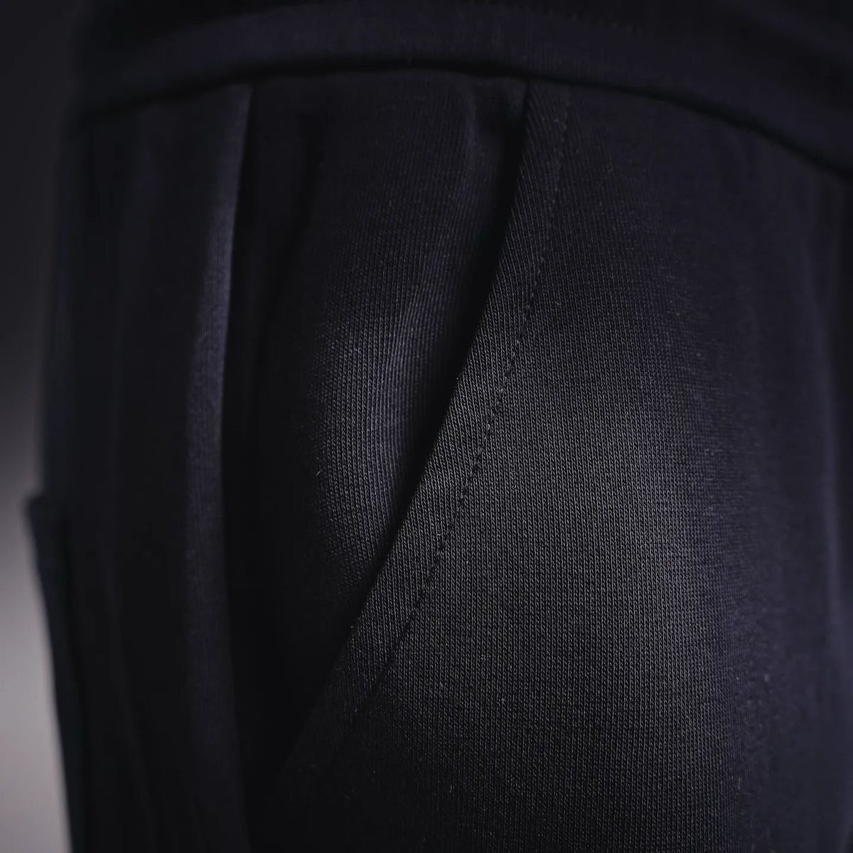 Fendi dark pants with diagonal seam and fabric texture