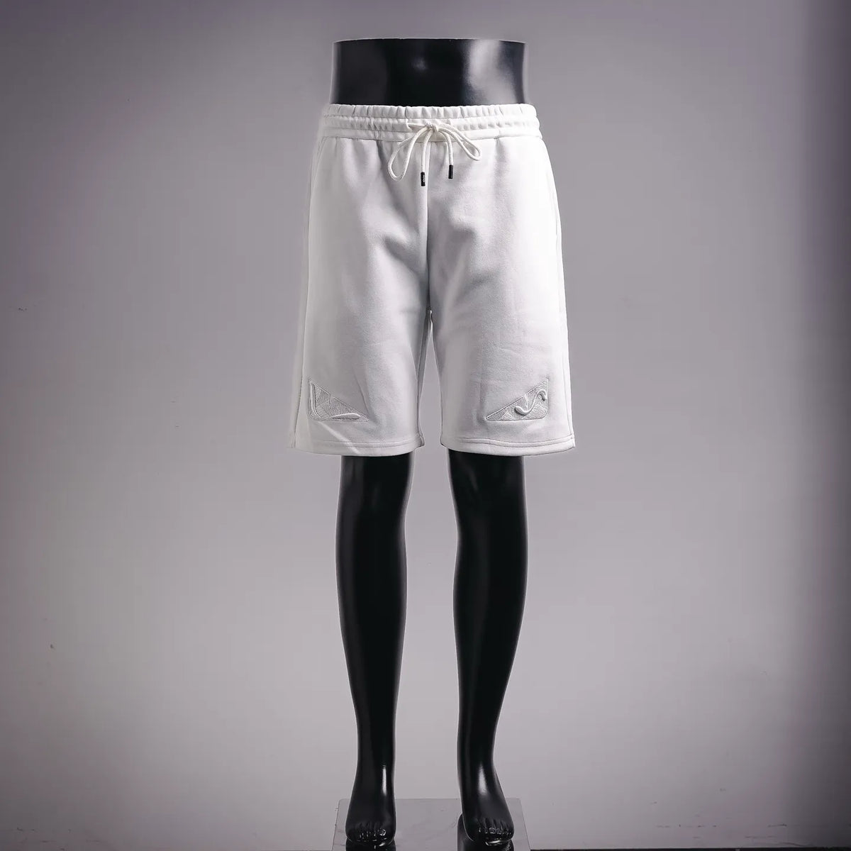 White Fendi drawstring shorts with embroidered logo on left leg