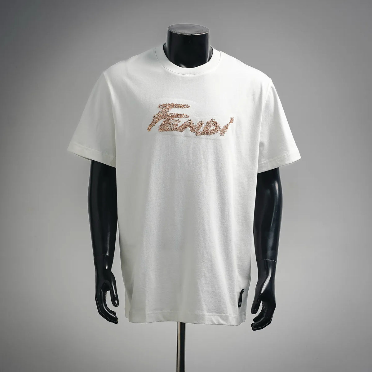 White T-shirt with gold sequin logo text on the chest