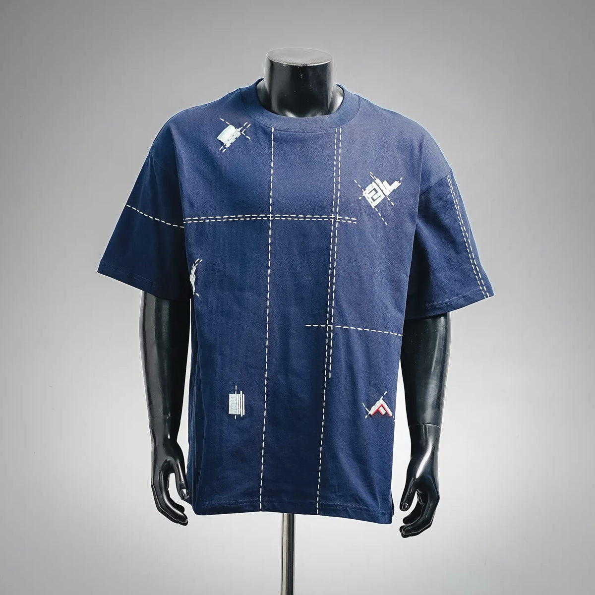 Blue short-sleeve T-shirt with white dashed stitch graphic on front