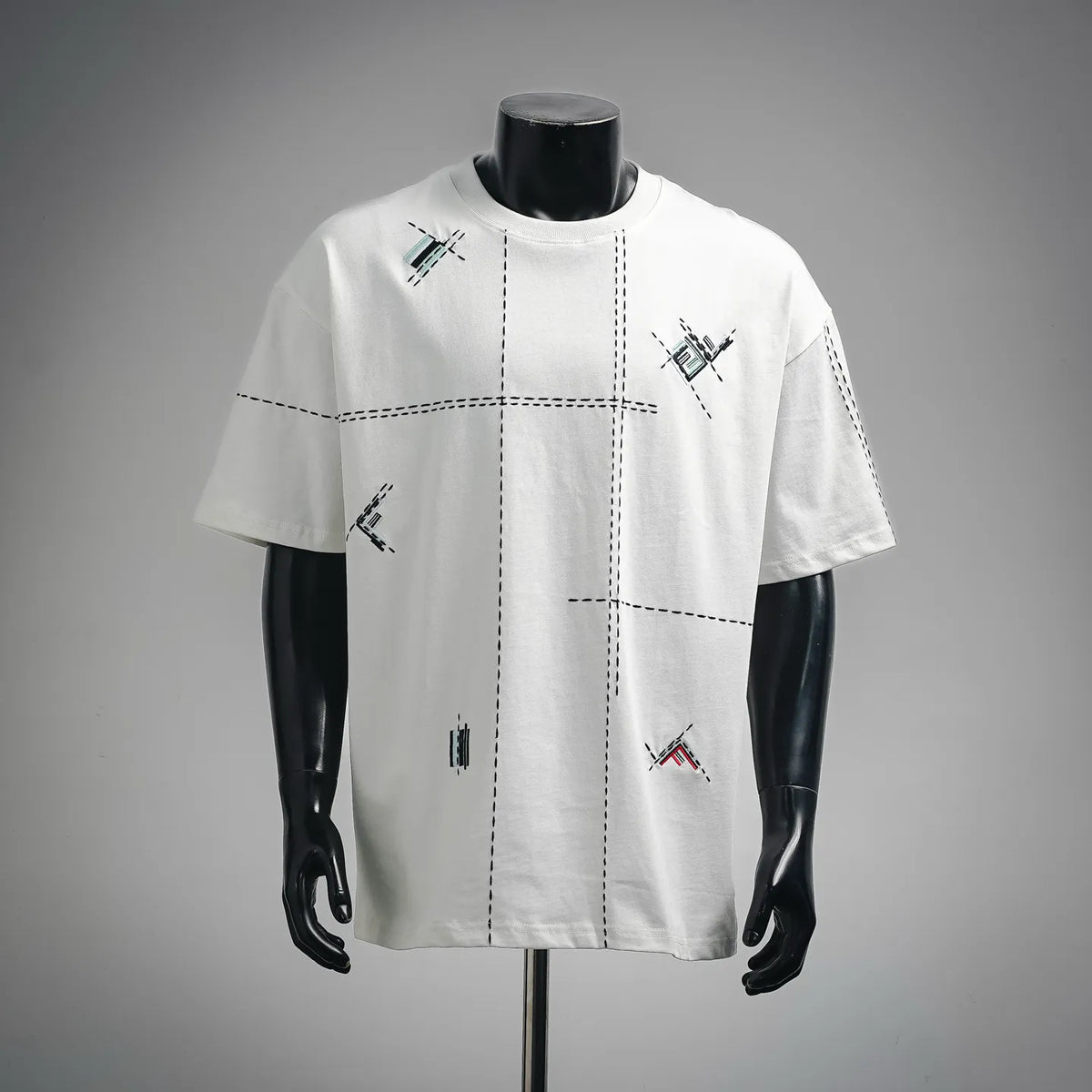 White short-sleeve T-shirt with stitched grid and multicolor graphic accents