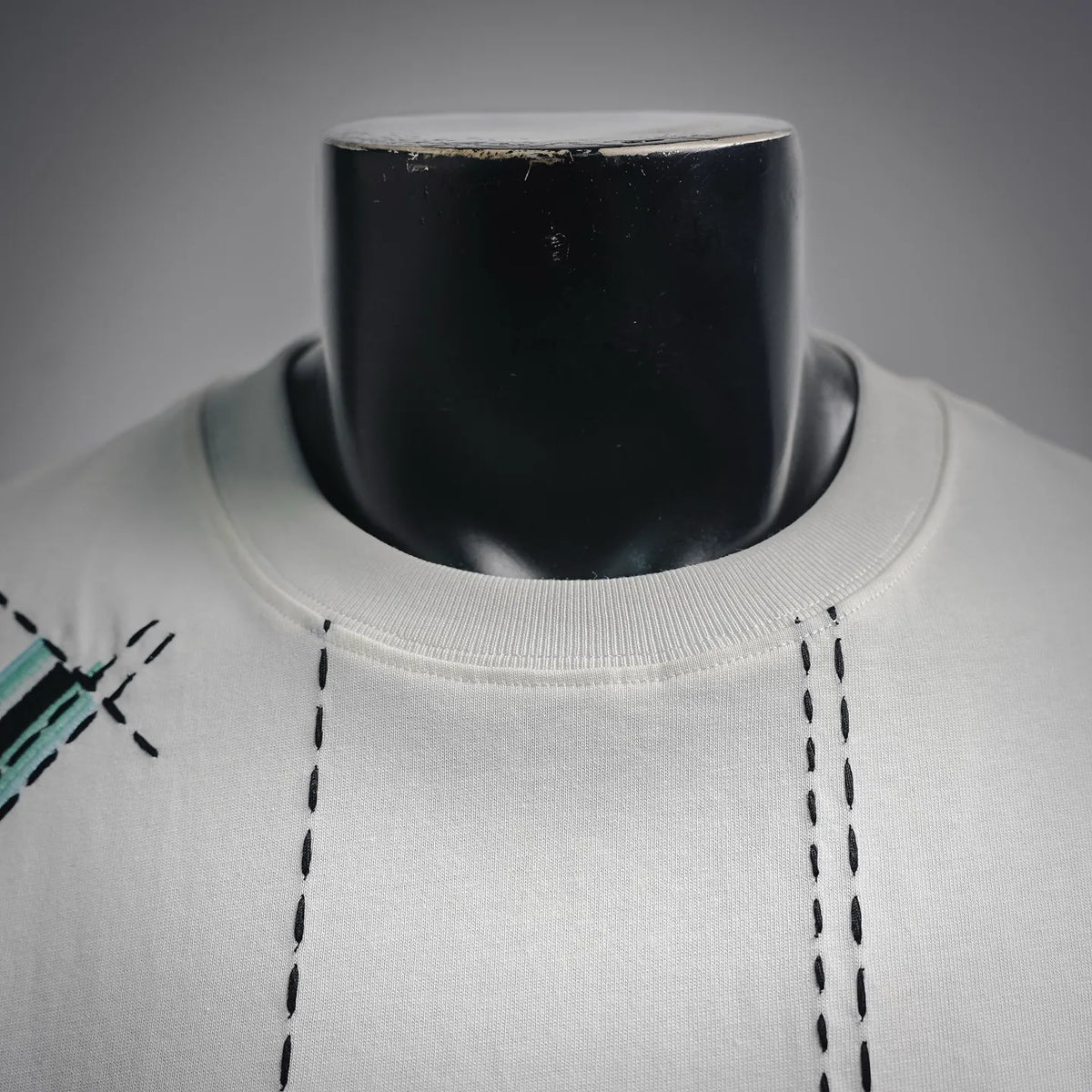 White crew-neck T-shirt collar with ribbed neckline and dashed stitch trim
