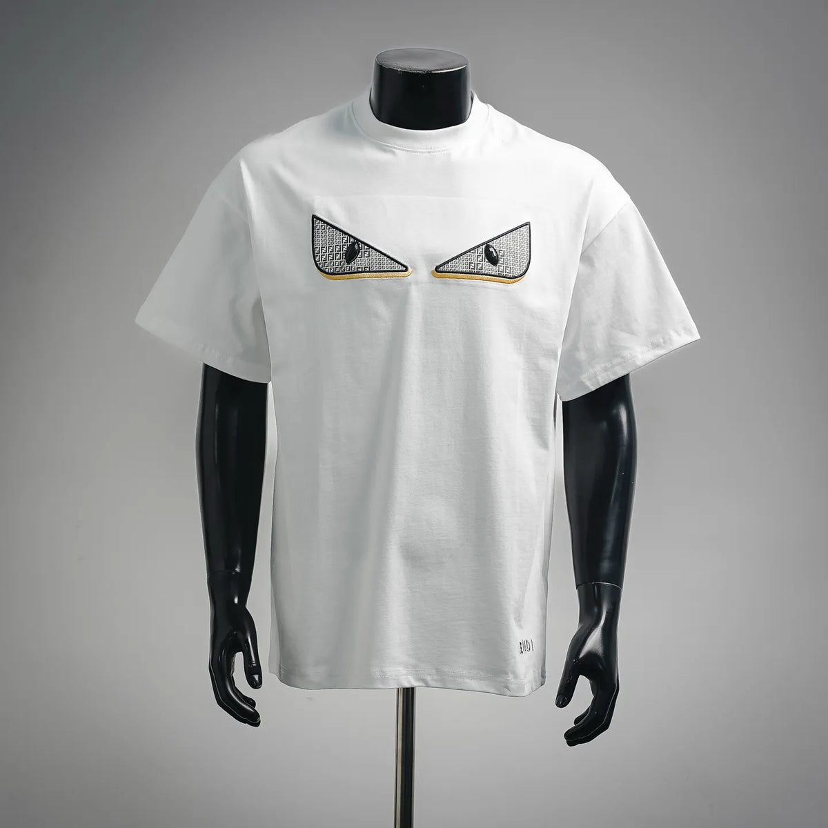Fendi white crewneck short-sleeve T-shirt with black eye applique on chest