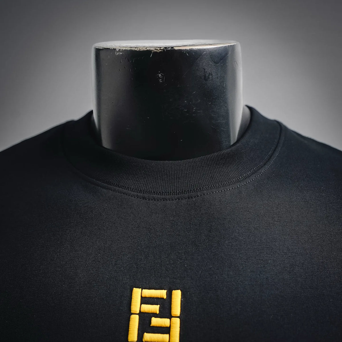 Fendi short-sleeve T-shirt, black crew neck with small yellow Fendi logo