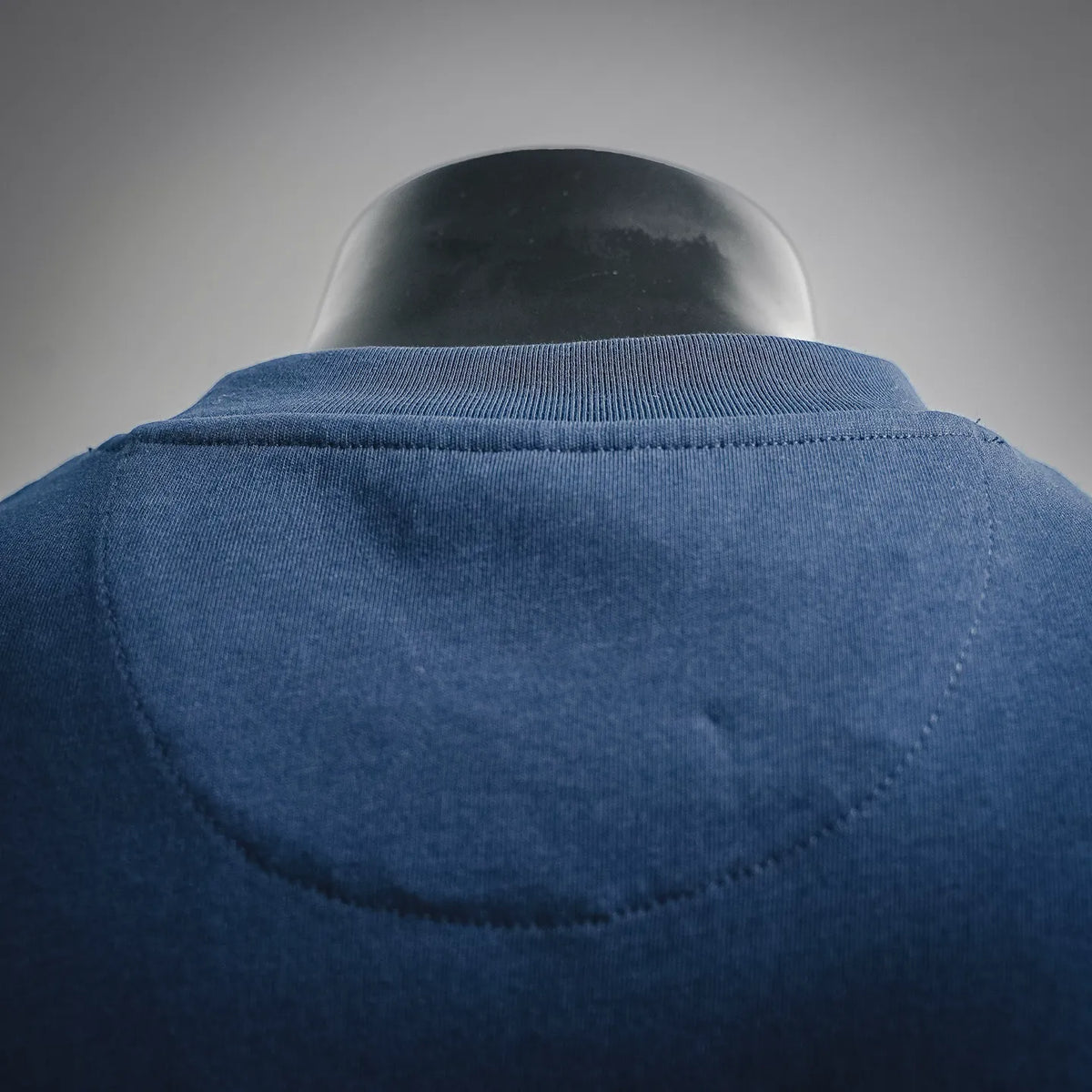 Blue T-shirt neckline and back yoke seam detail