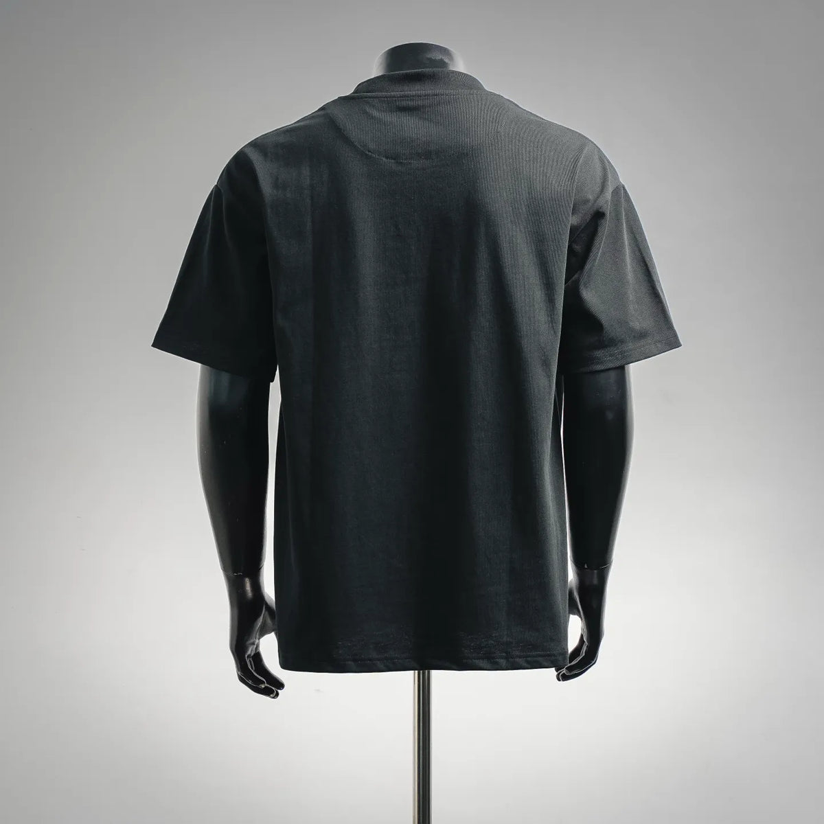 Black crew-neck T-shirt, plain back view on mannequin