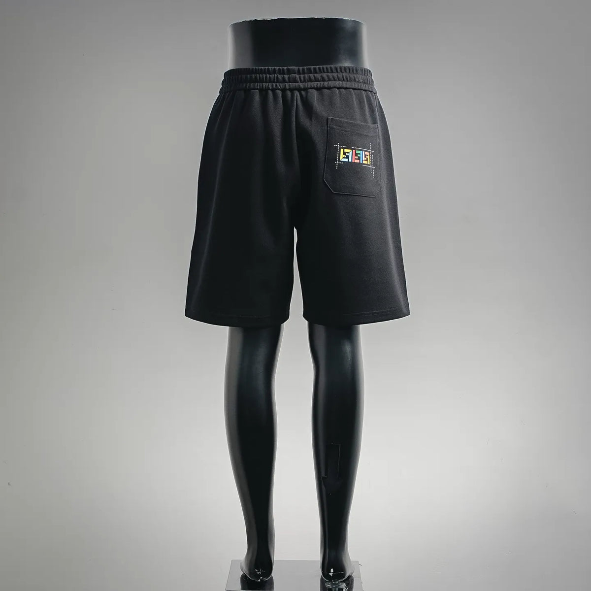 Fendi black shorts with elastic waistband and small logo patch on leg