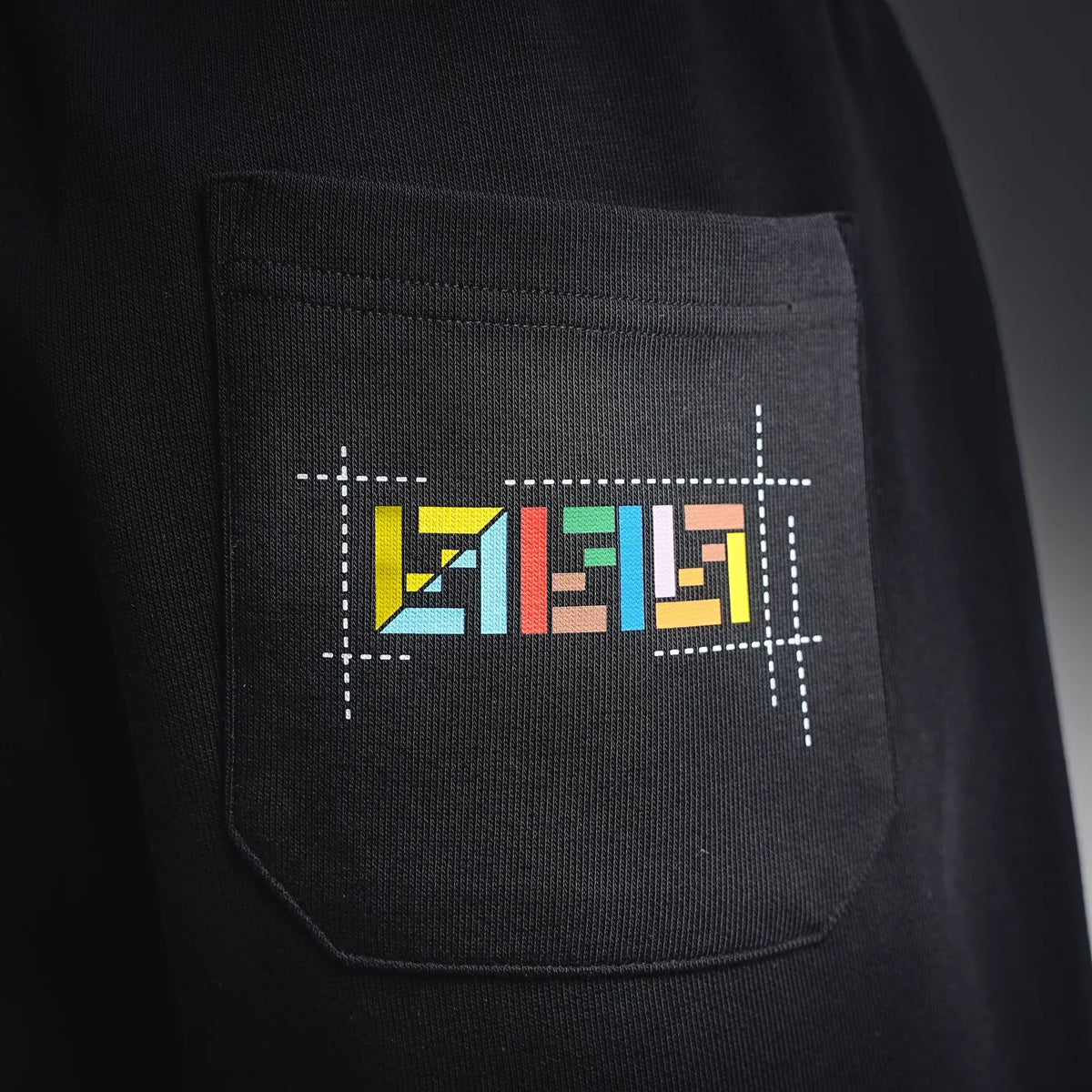 Fendi black shorts pocket with colorful FENDI logo graphic
