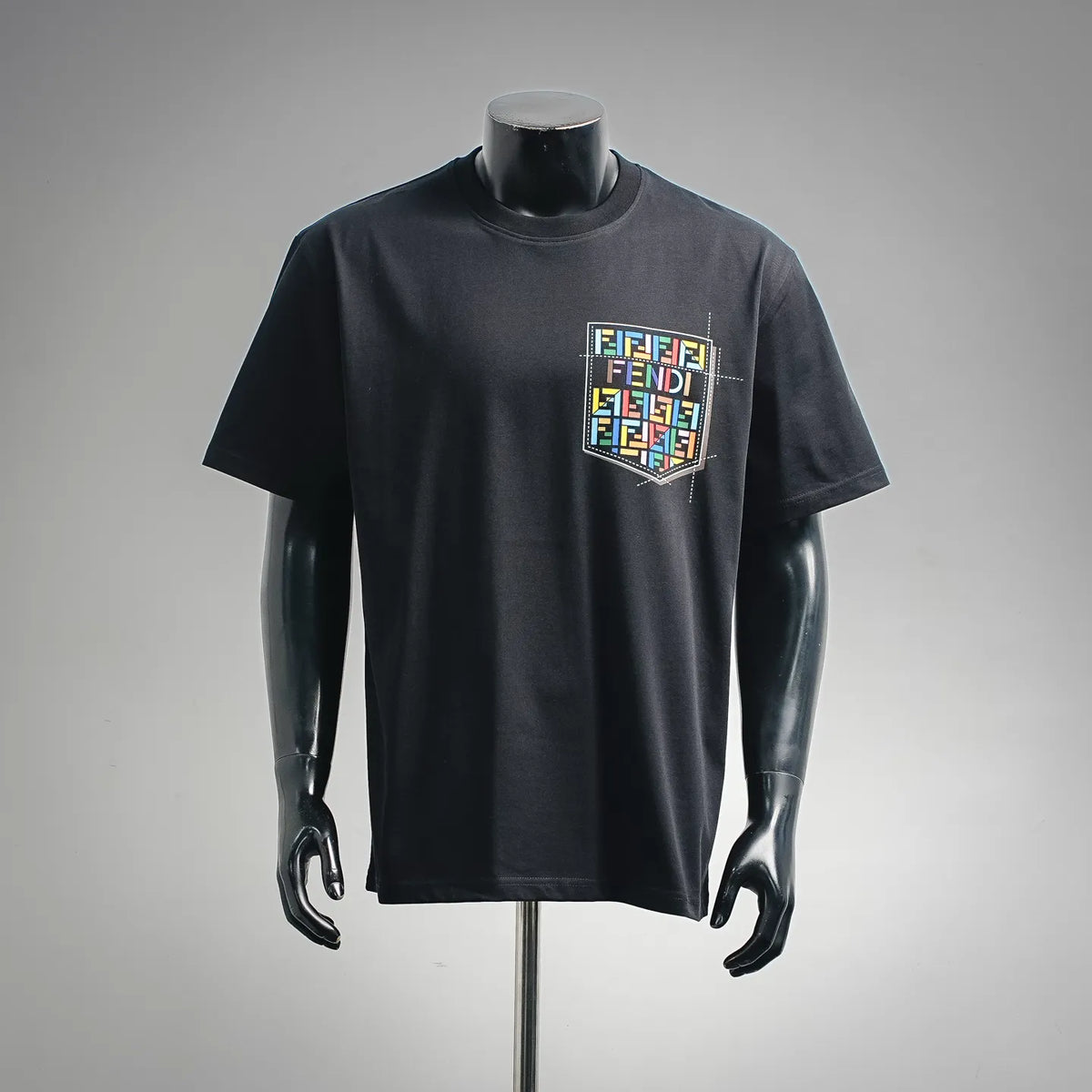 Black short-sleeve T-shirt with colorful Fendi logo graphic on chest.