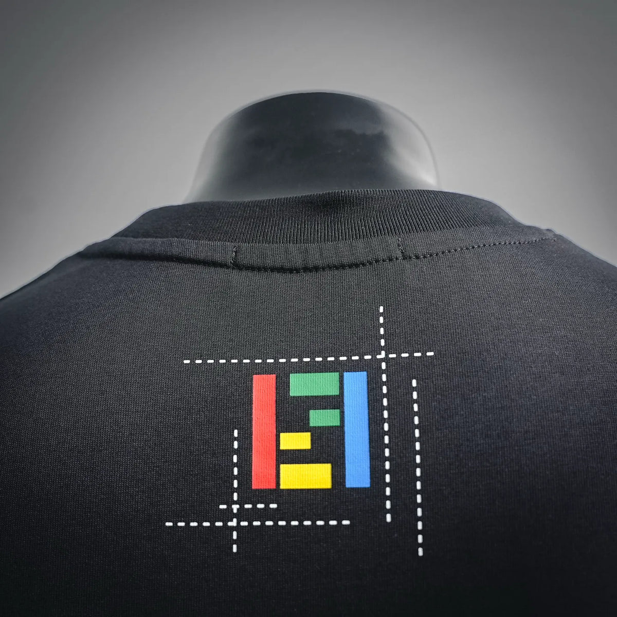 Black crewneck T-shirt with Fendi graphic on upper back.