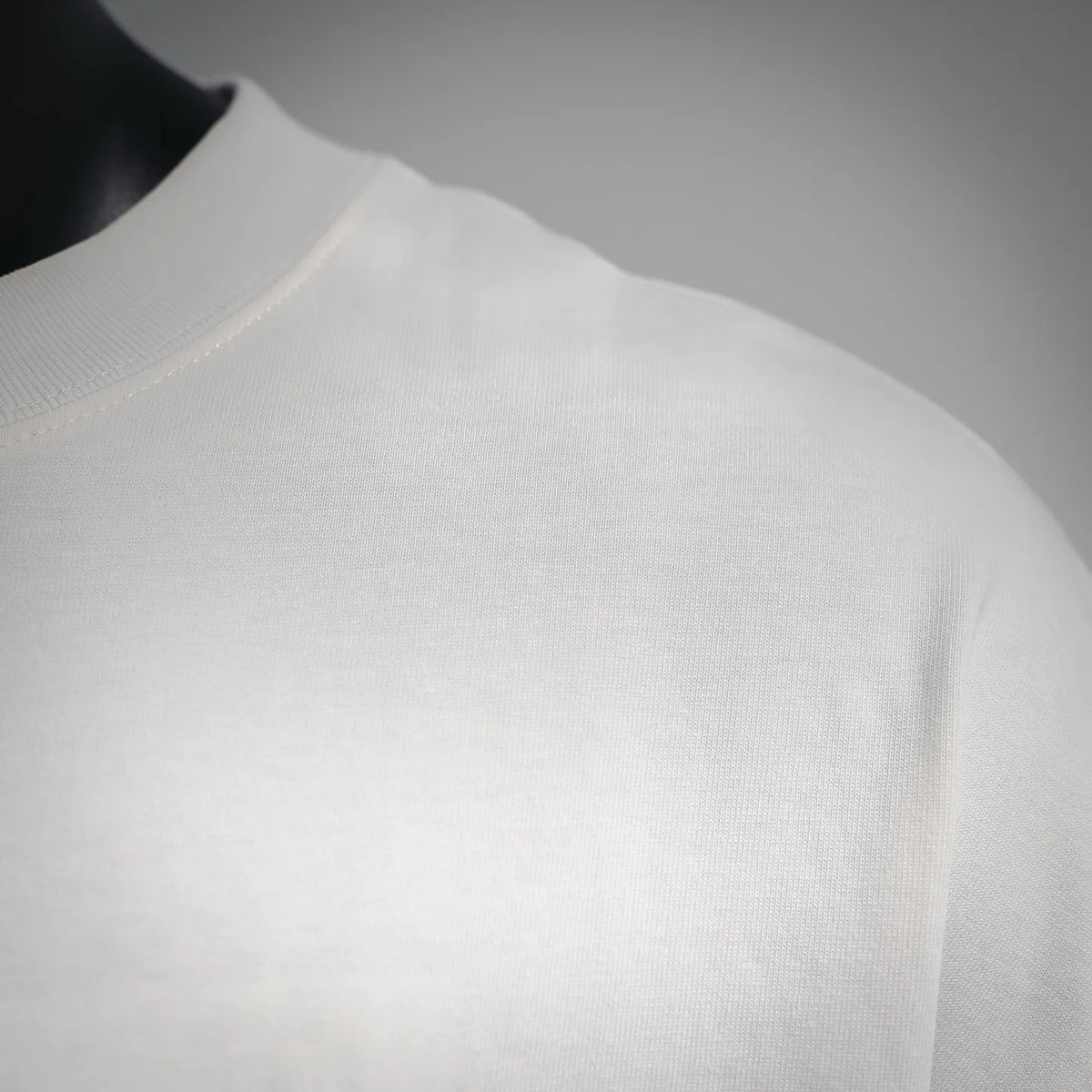 White Fendi short-sleeve T-shirt close-up of crew neck and smooth knit fabric