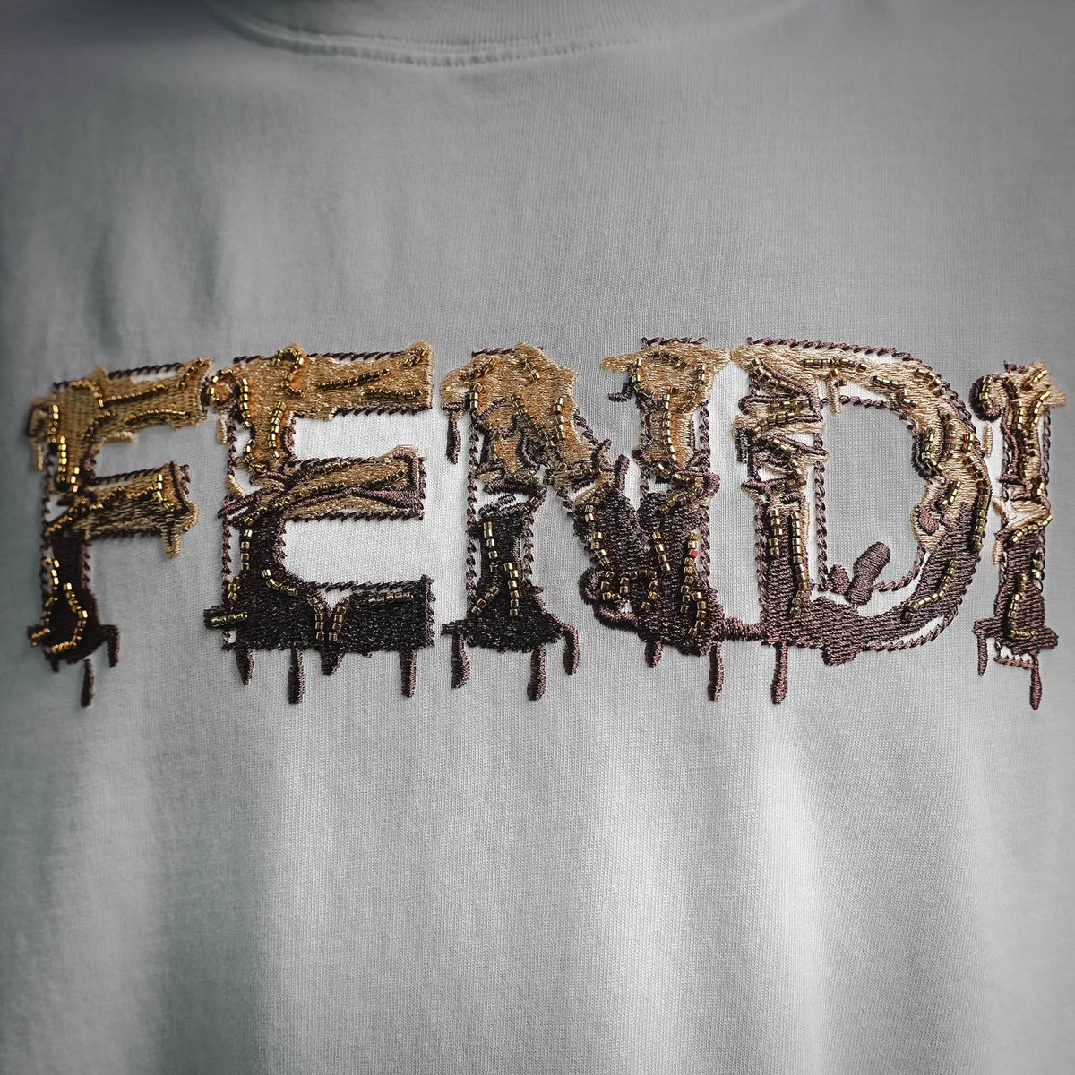 Embroidered front graphic with gold and dark thread