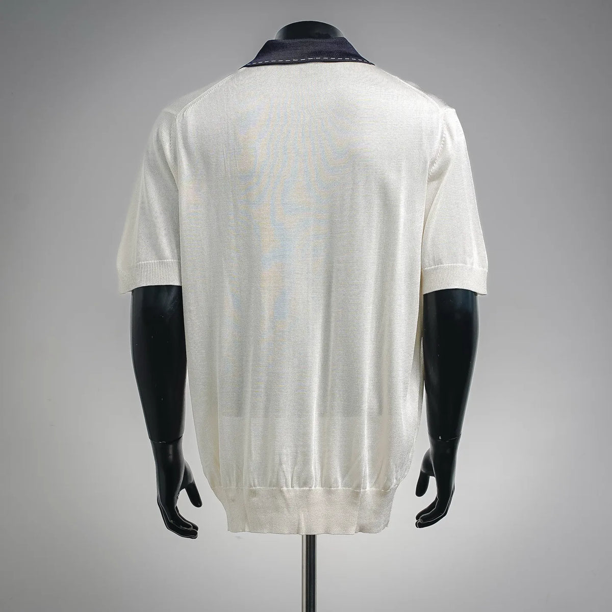 Fendi polo shirt back view in white knit with navy collar and short sleeves