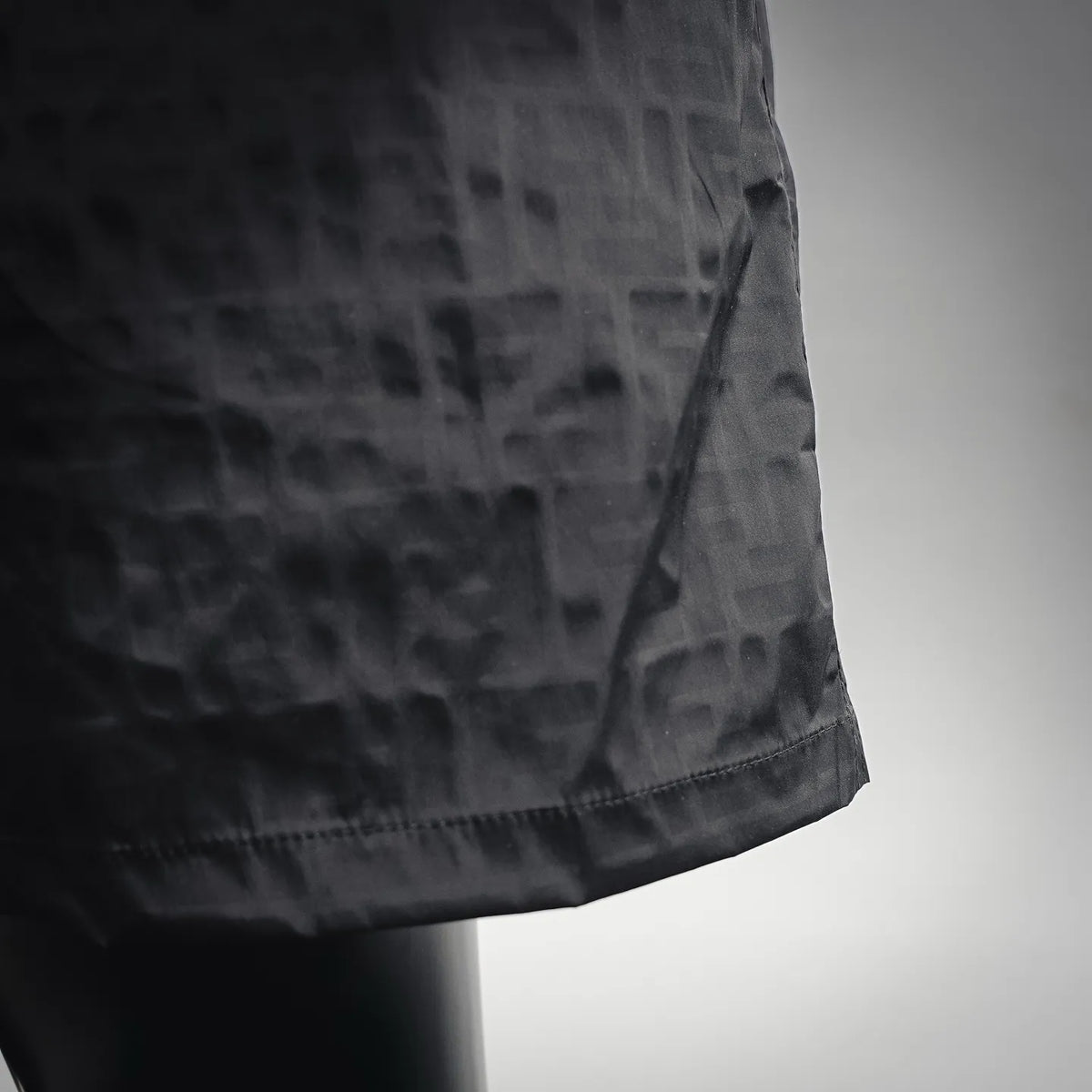 Black shorts hem with stitched side seam detail
