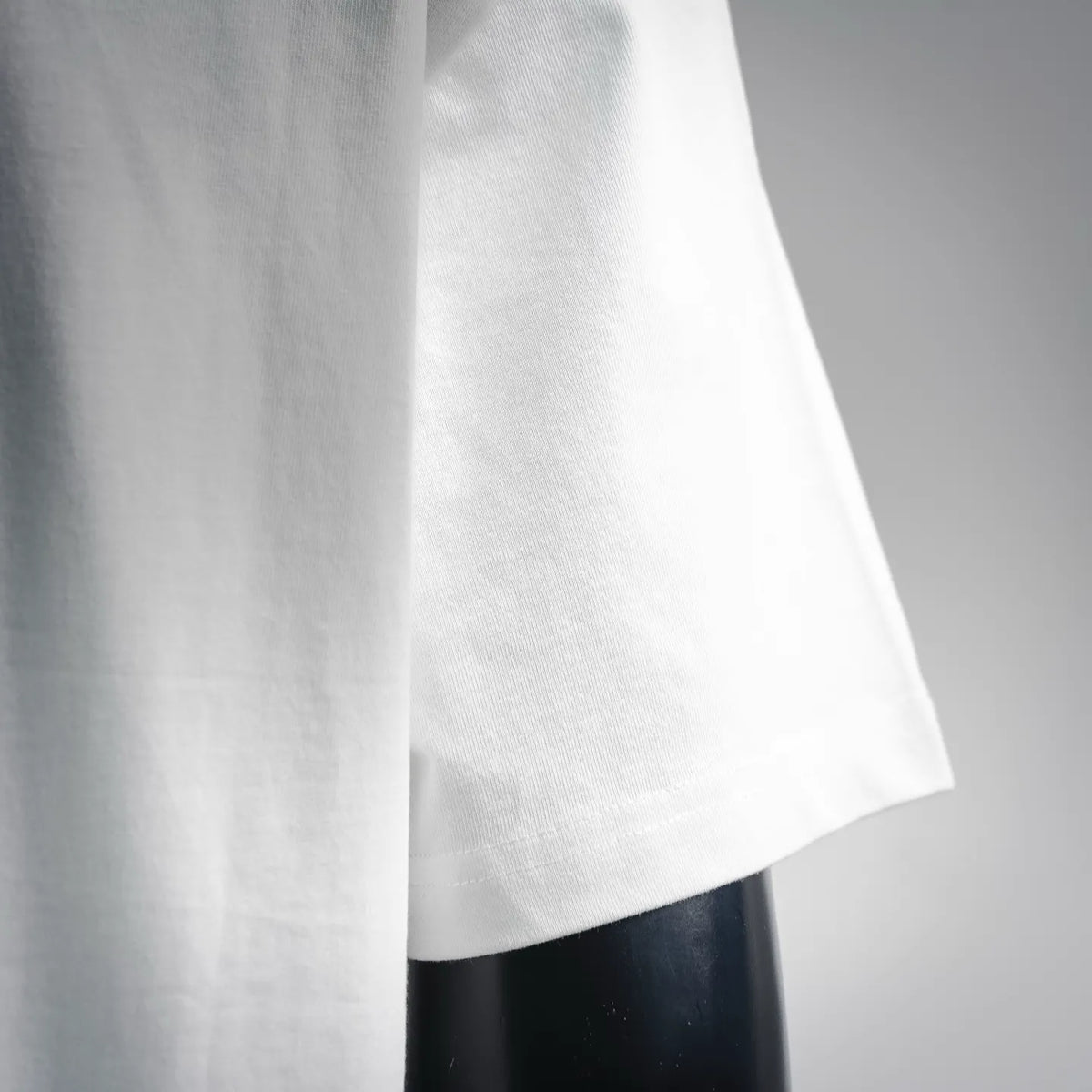 White Fendi short-sleeve T-shirt with smooth knit fabric and side drape