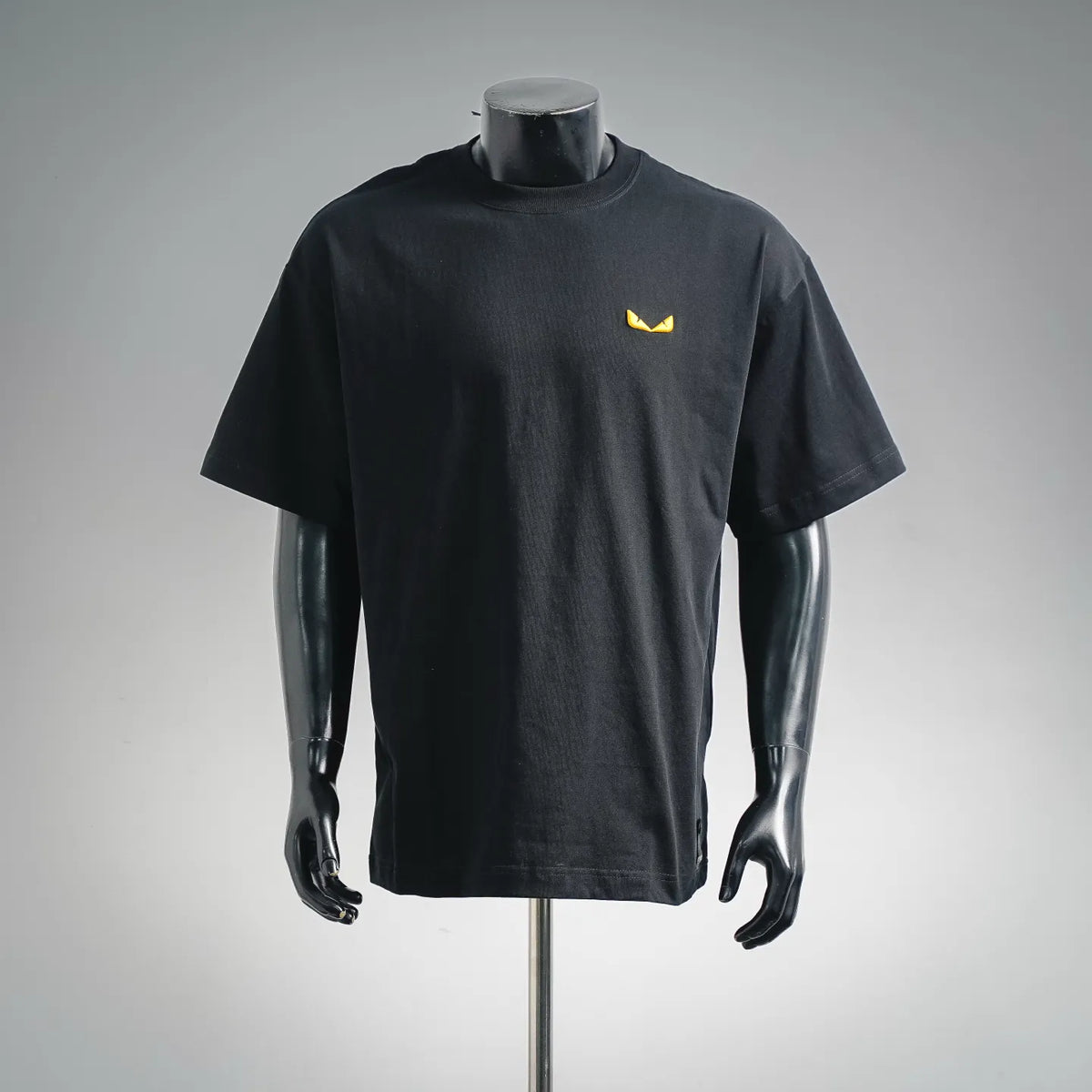 Black crew-neck short-sleeve T-shirt with yellow Fendi logo on chest