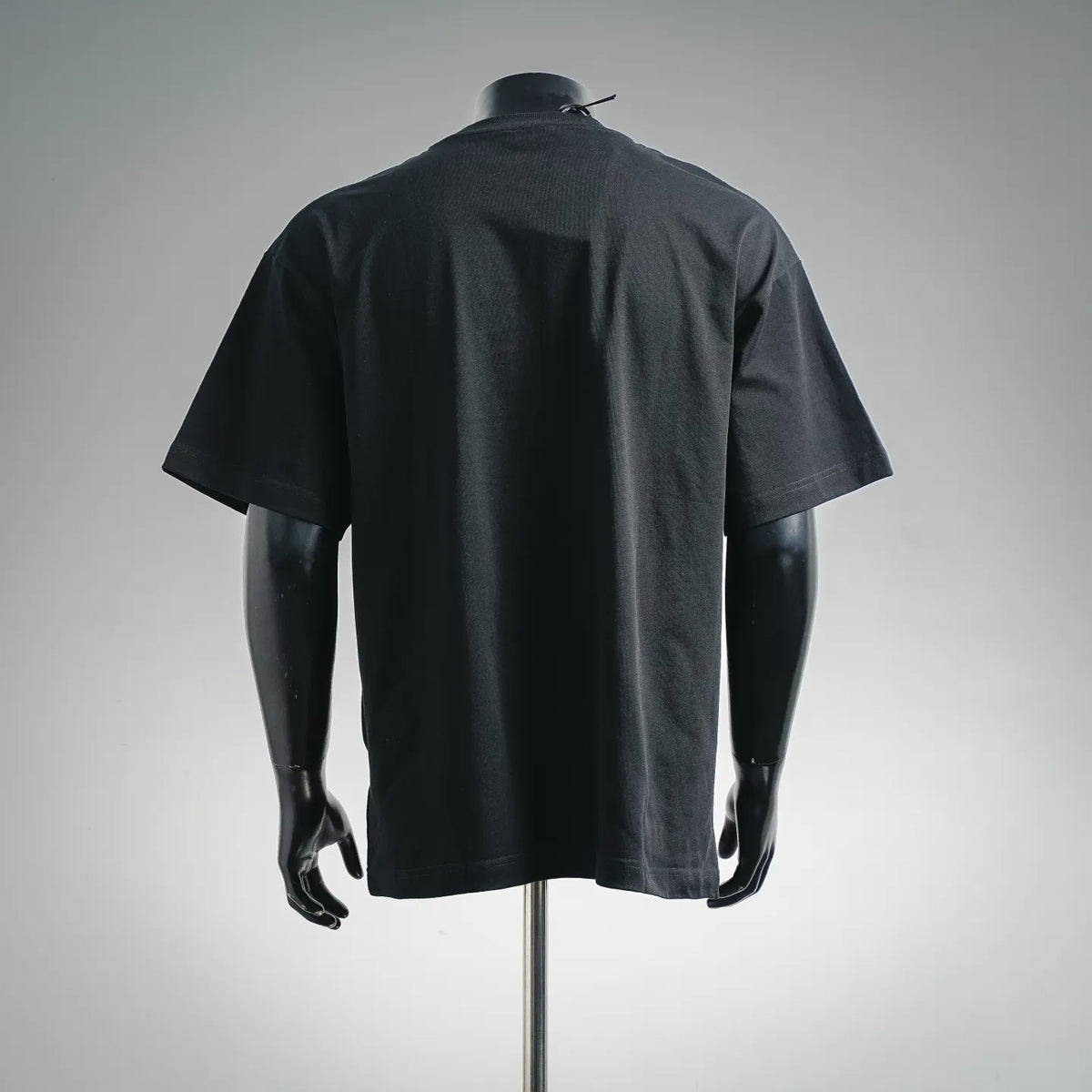 Black crew-neck short-sleeve T-shirt, back view on mannequin