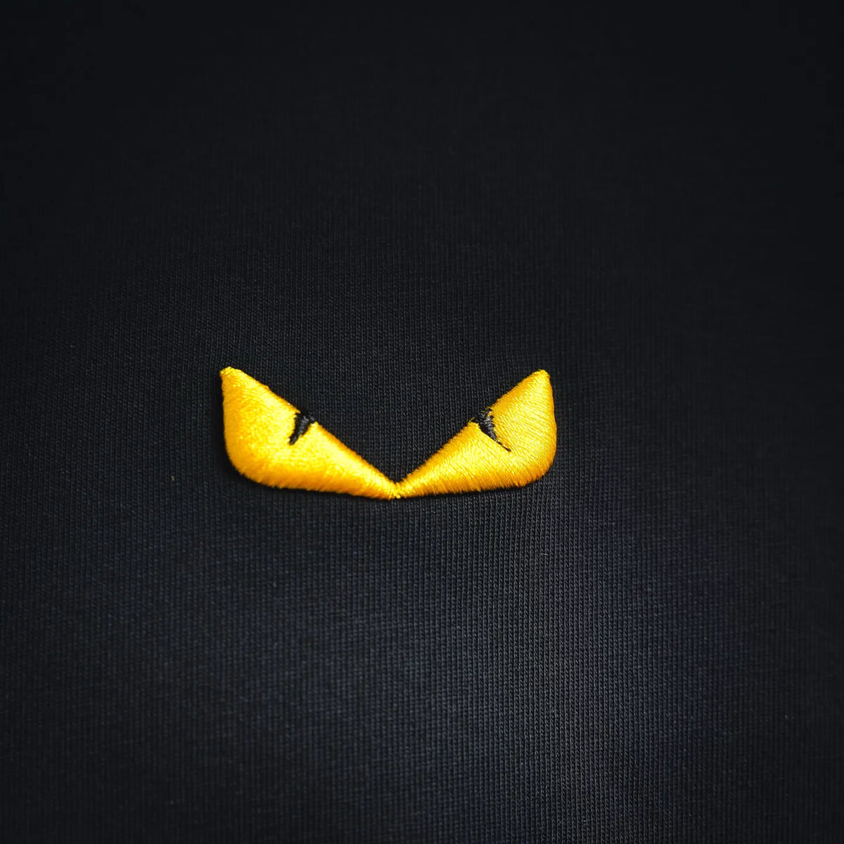 Yellow Fendi crown logo patch on black crew-neck T-shirt