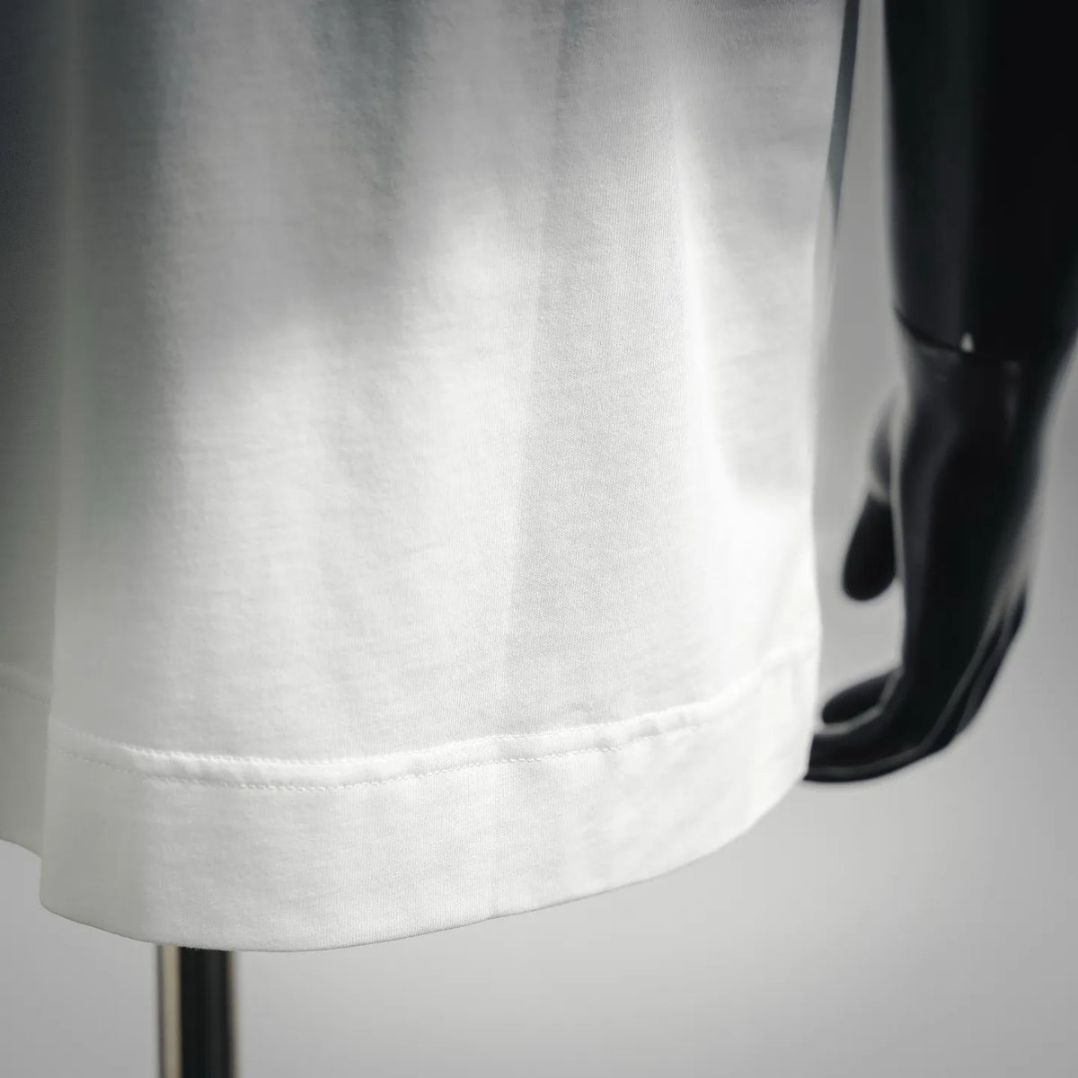 White T-shirt hem with double-stitched edge