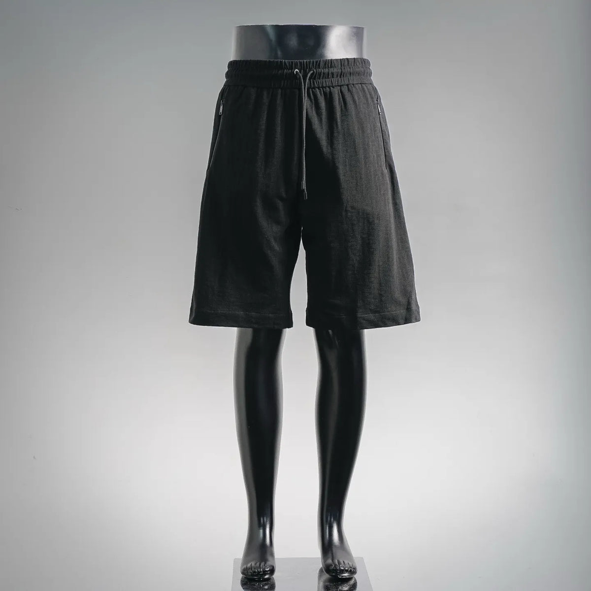 Black drawstring waist shorts with relaxed fit