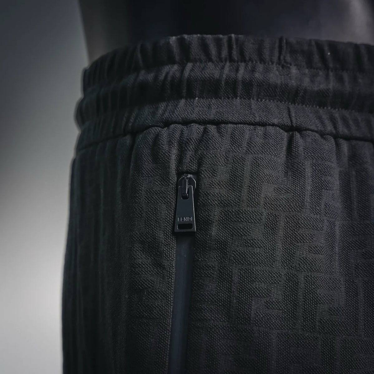 Black drawstring shorts with elastic waist and FENDI tag detail
