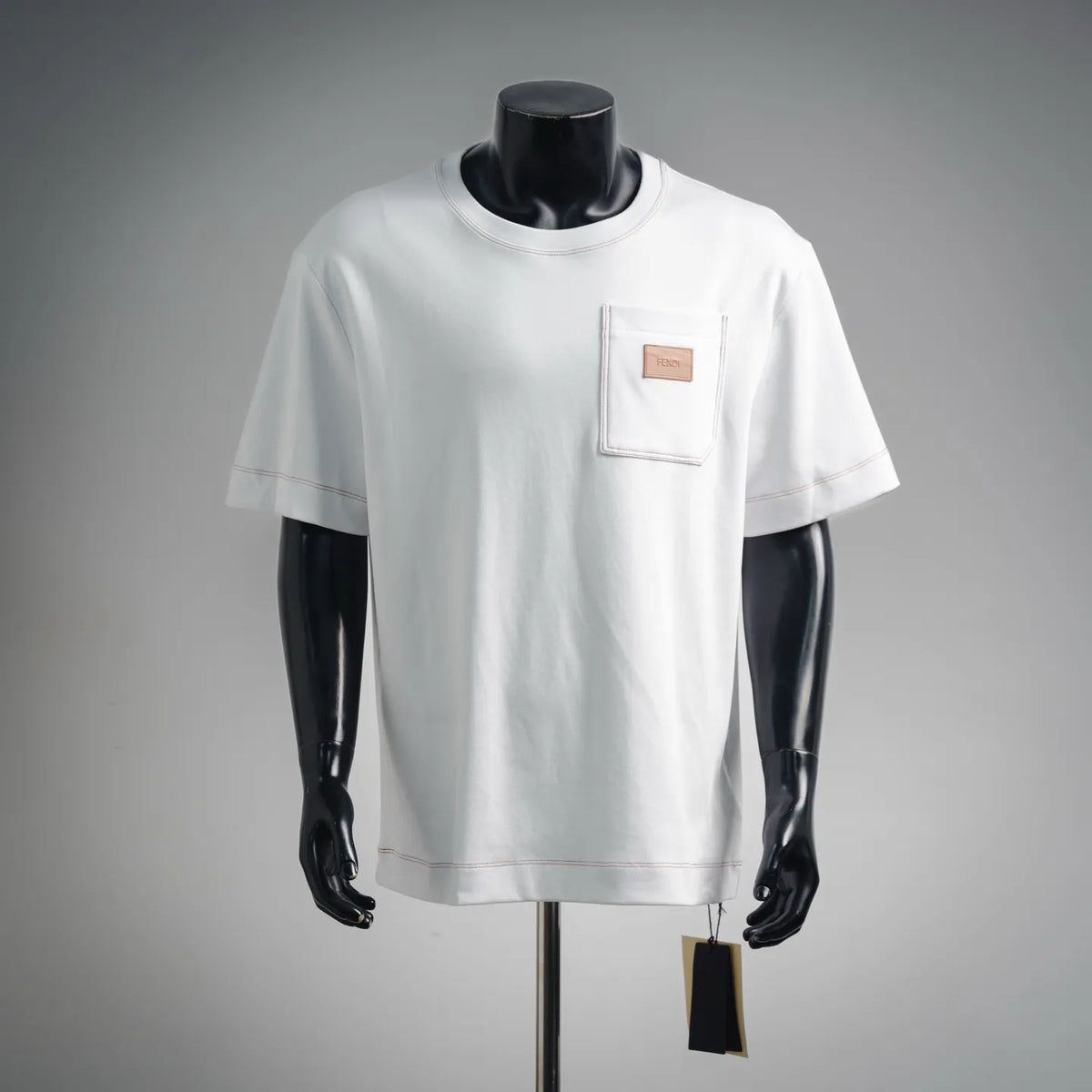 White short-sleeve T-shirt with front chest pocket and FENDI leather patch logo