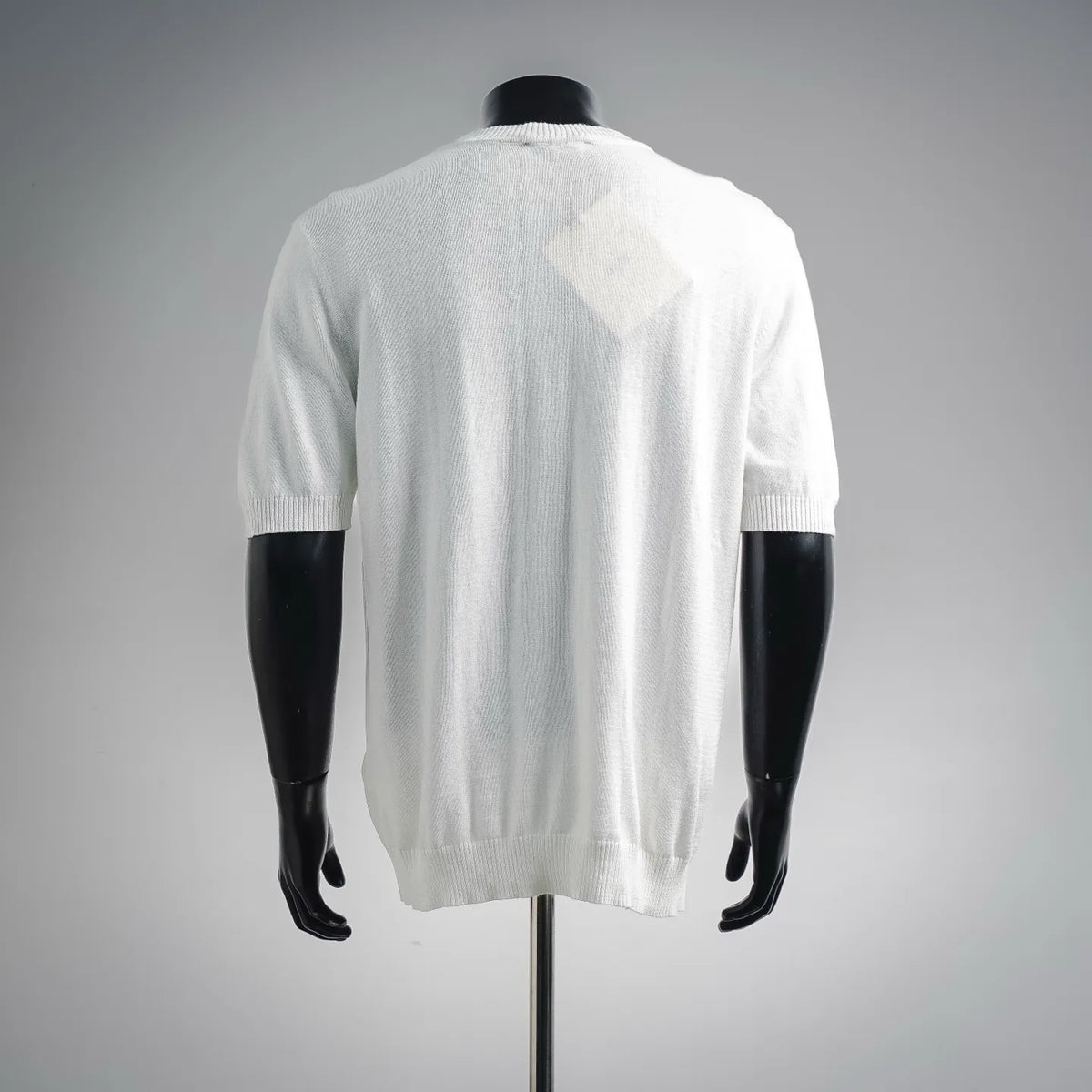 White crewneck knit sweater, back view with short sleeves and ribbed hem