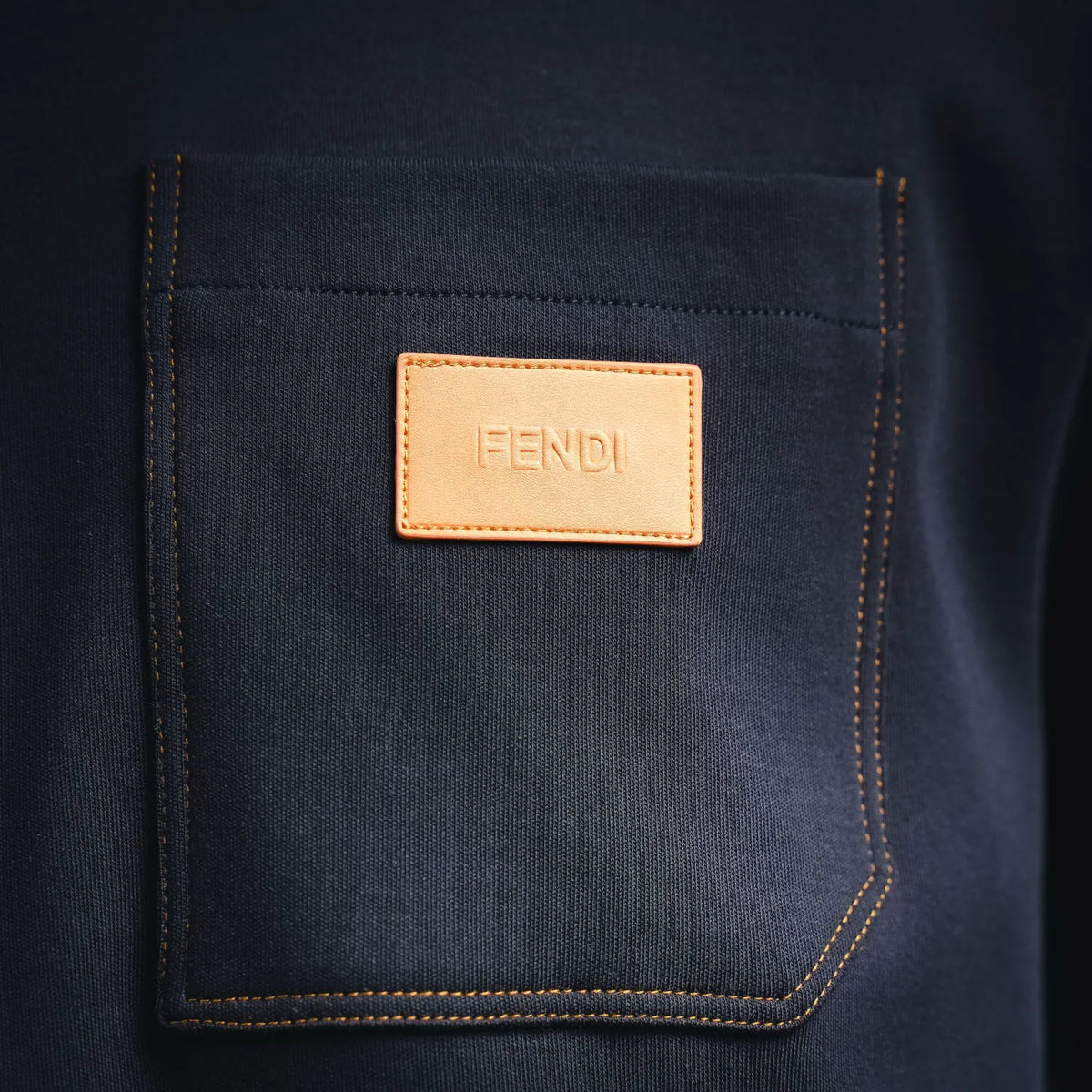 Fendi dark blue shirt with square tan logo patch on front chest pocket