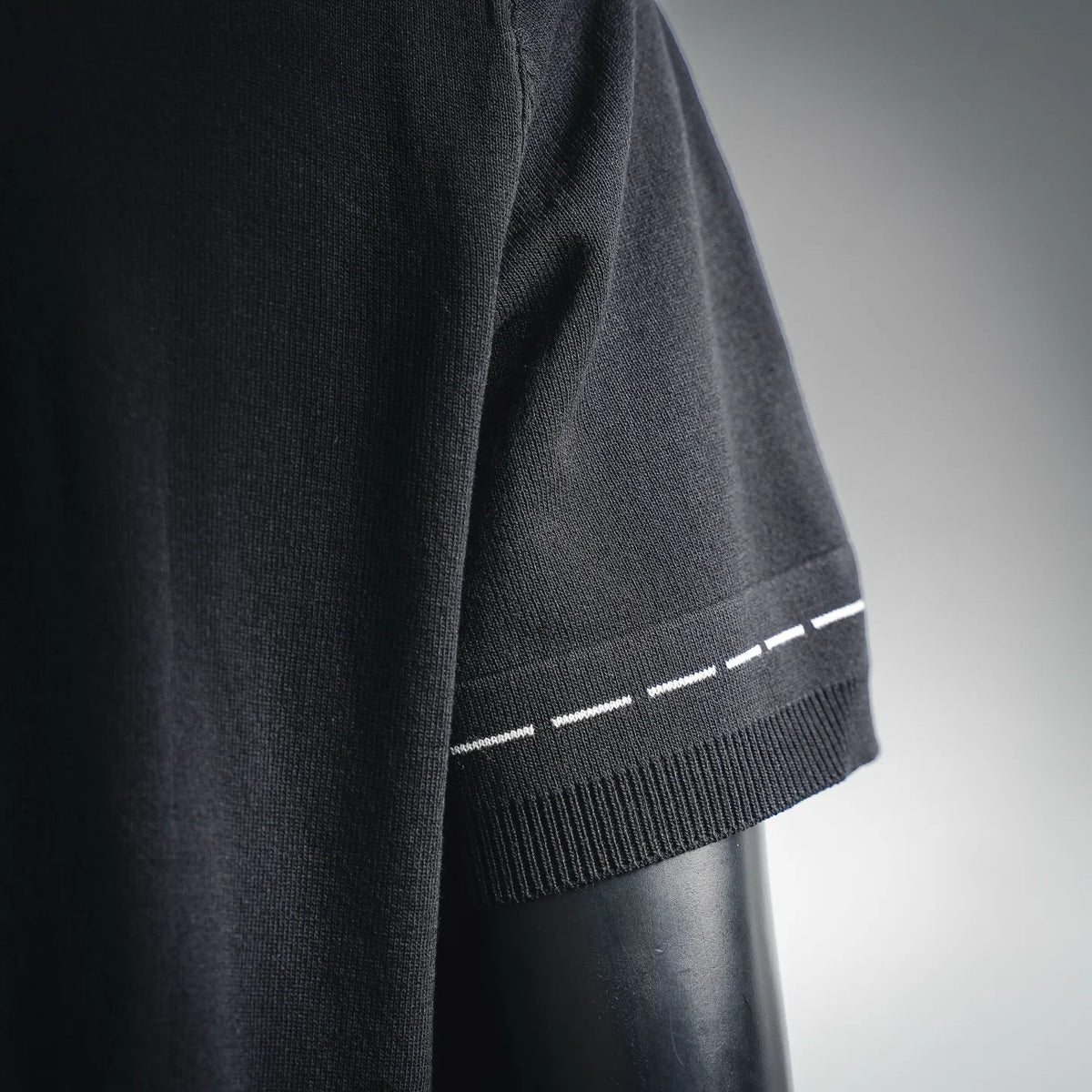Fendi black knit short sleeve with ribbed cuff and white stitched stripe