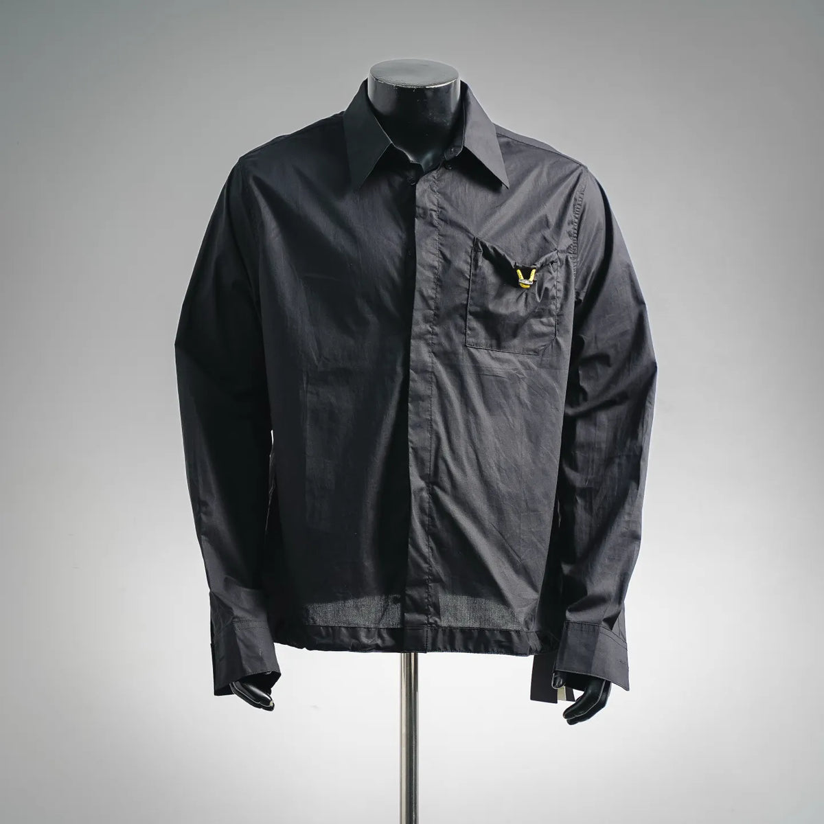 Black Fendi button-up coat with logo pocket detail and shirt collar