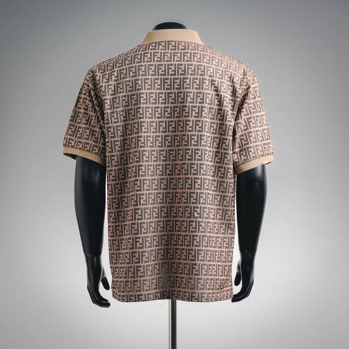 Fendi FF monogram polo shirt on a mannequin, short sleeves, tan and dark pattern