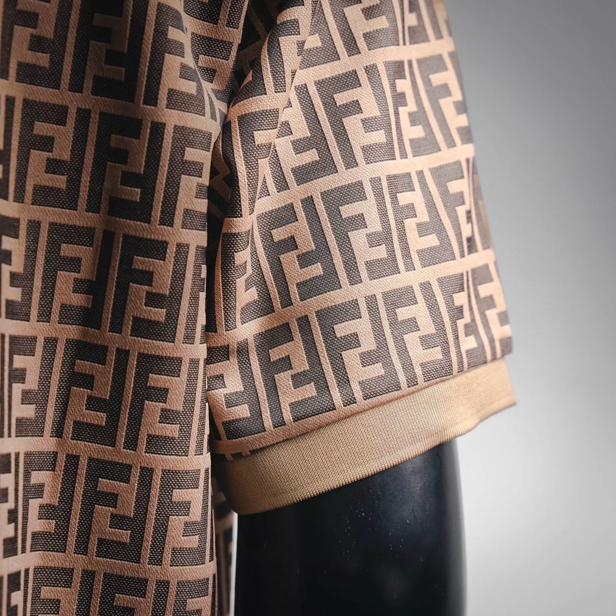 Fendi polo shirt hem and cuff detail, tan knit with dark FF monogram pattern