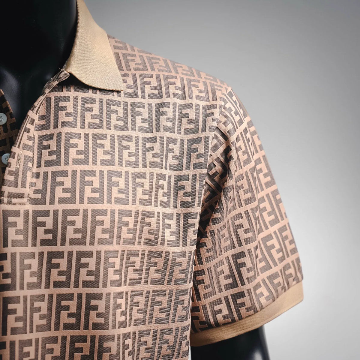 Fendi polo shirt side view with short sleeves, tan collar and FF monogram pattern