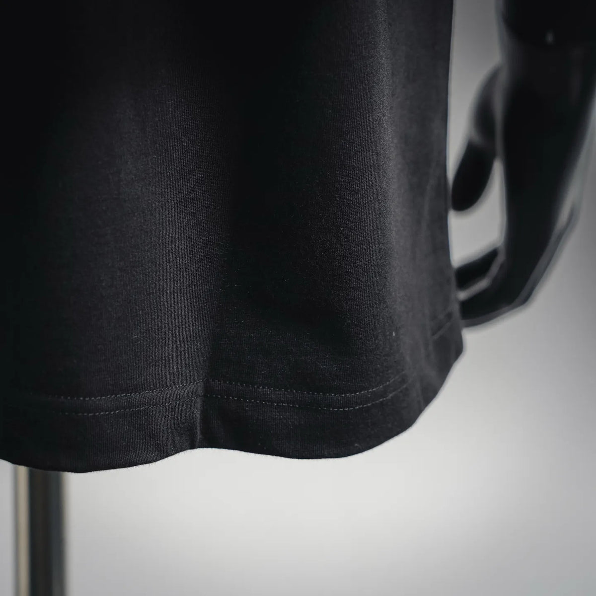 Fendi black T-shirt hem with double stitching at the bottom edge