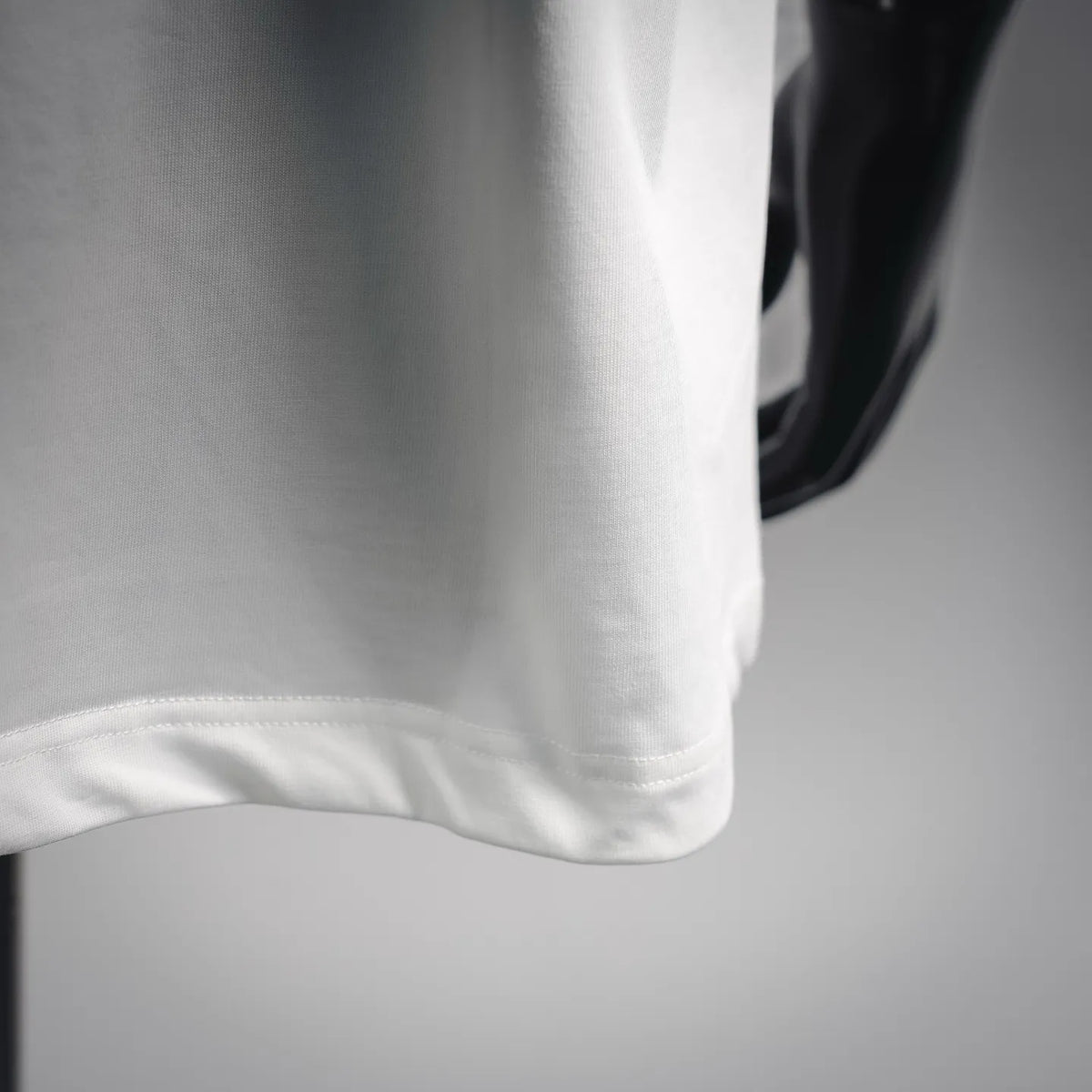 White T-shirt hem and sleeve cuff with stitched edge
