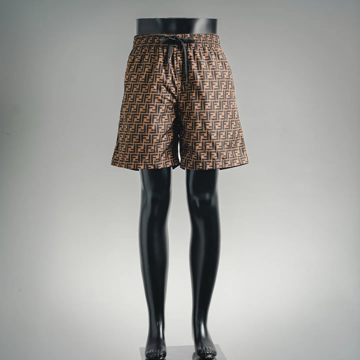 Brown and black patterned drawstring shorts with elastic waistband