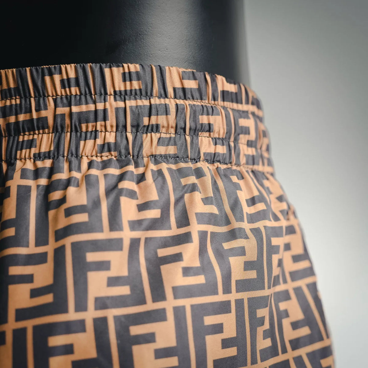 Close-up of brown and black patterned fabric with elastic waistband